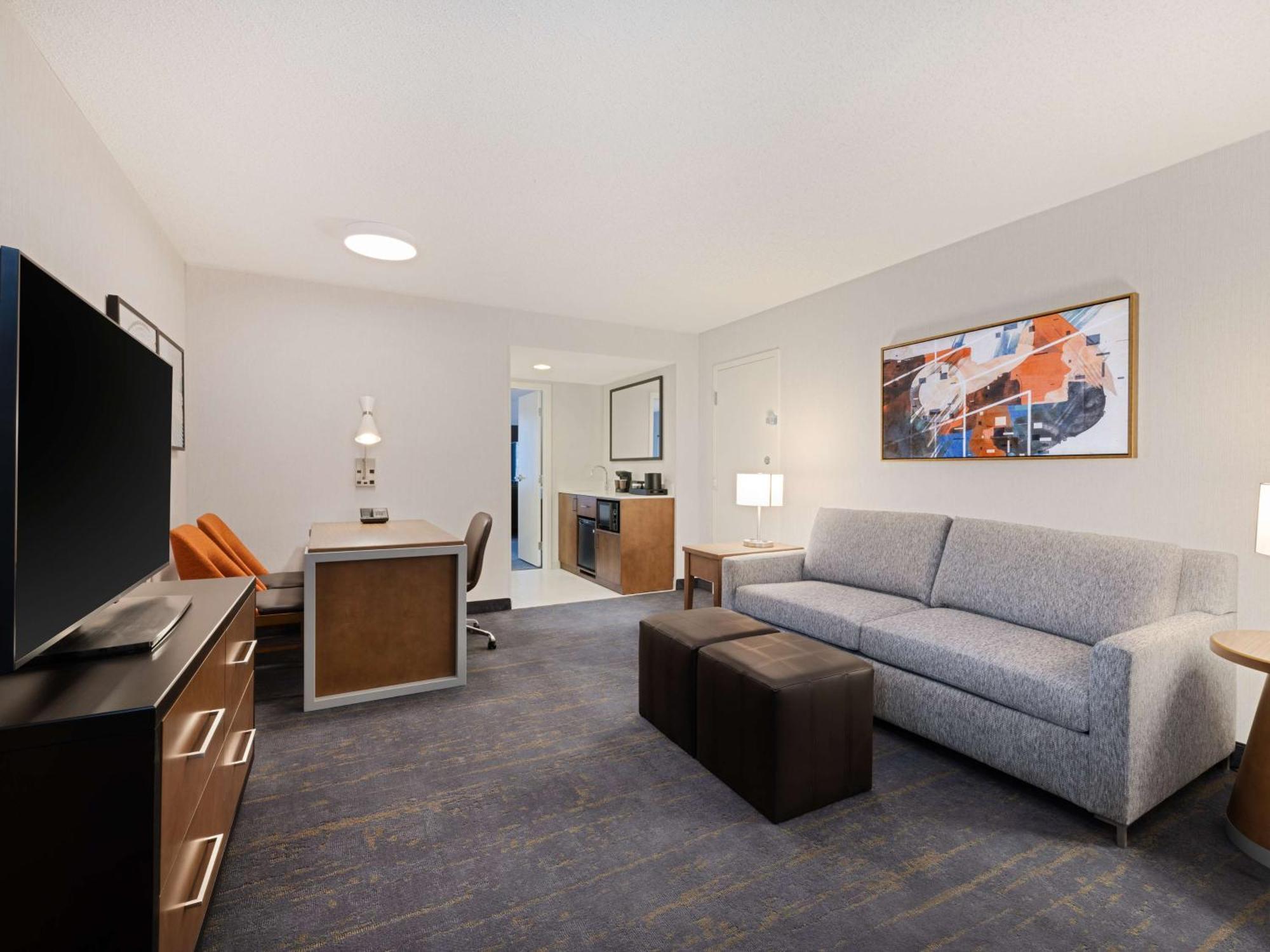Two Room Corner Suite with Two Double Beds and Sofa bed, City View – Non-Smoking